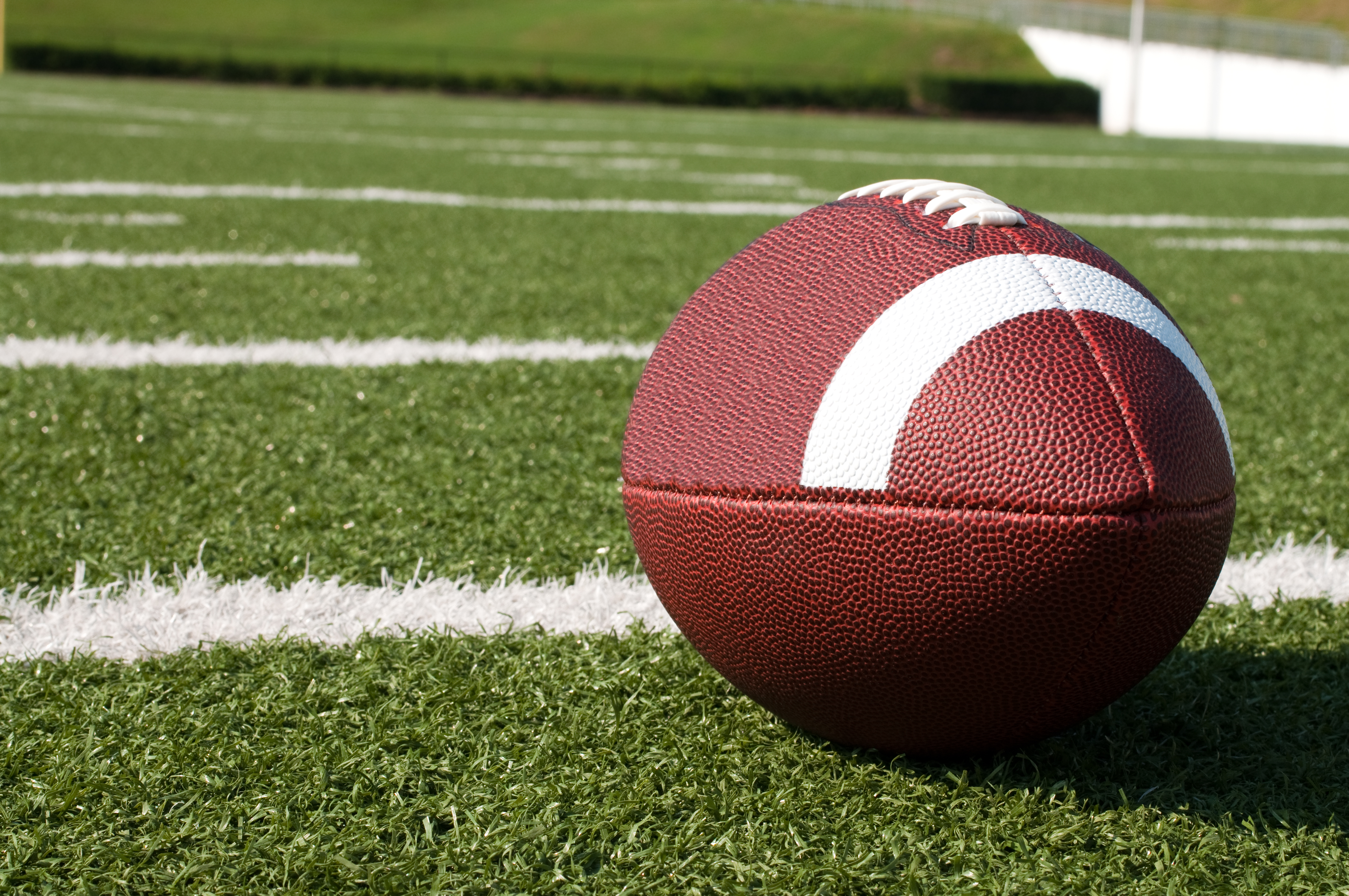 Closeup of American Football on Field - Genesis Turf